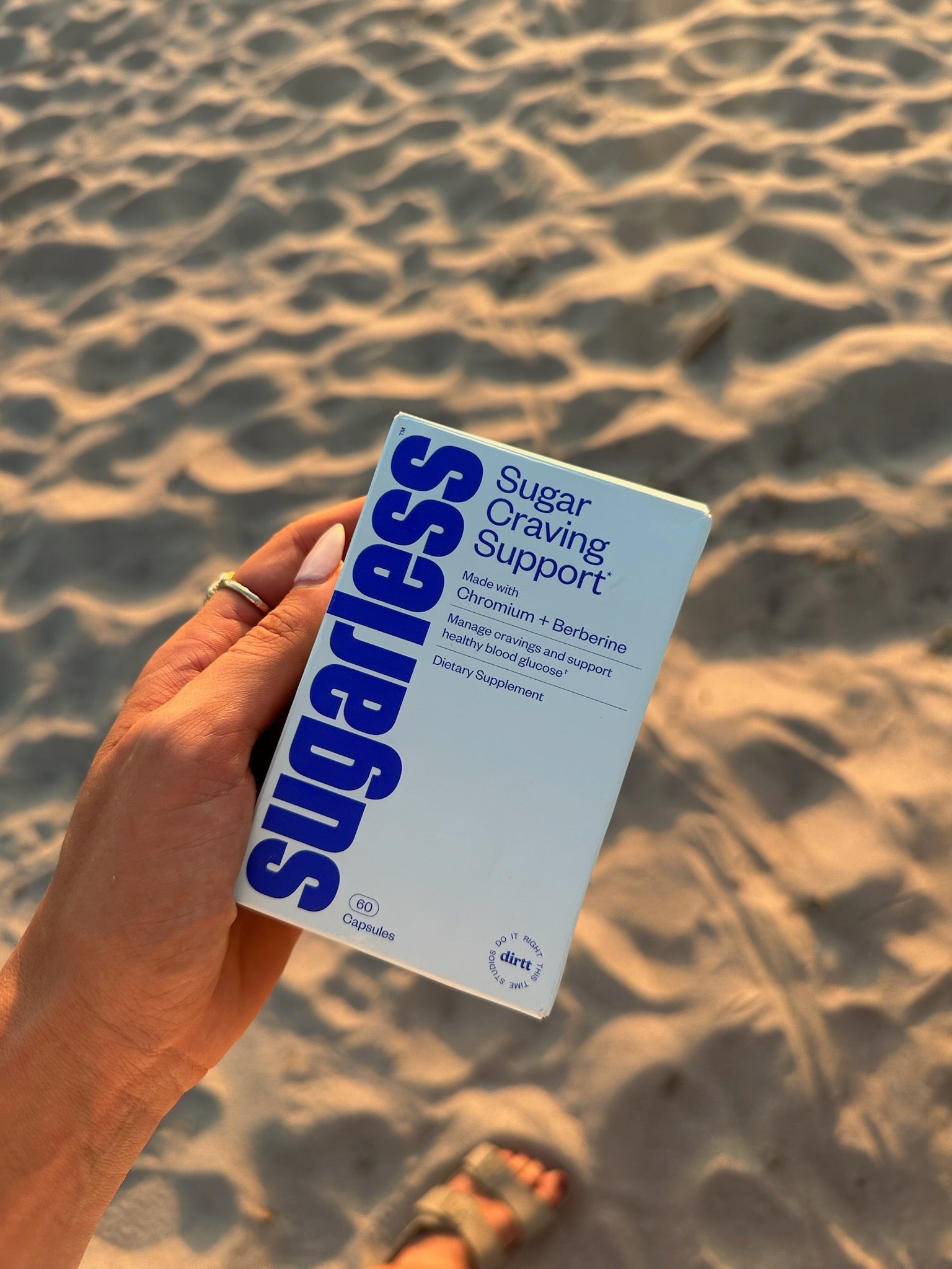 a box of sugarless on a beach